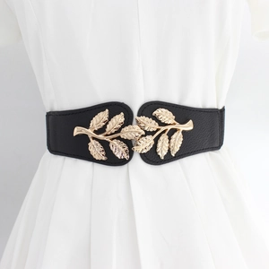 Elegant women's black elastic waist belt with a detailed golden metal leaf buckle