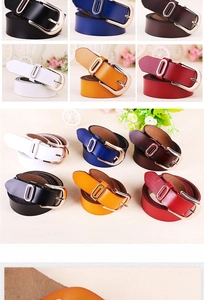 Detail showing various colors of women's leather belts with golden oval buckles