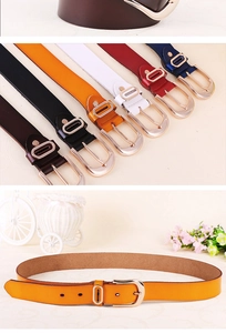 Detail view of colorful leather belts for women with elegant golden oval buckles