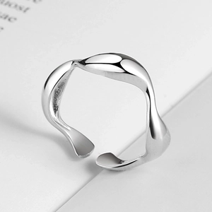 Minimalist S925 sterling silver ring featuring an irregular liquid metal wave design