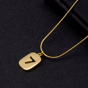 Macro shot of gold stainless steel snake chain featuring a numeric number 7 pendant