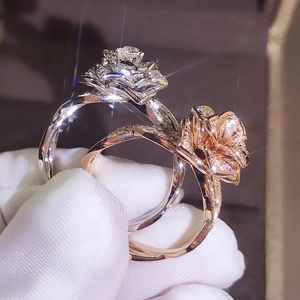 18K rose gold and silver rose shaped rings with shimmering zircons and twisted bands