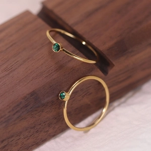 Minimalist gold titanium steel ring set with elegant dark green zircons for women