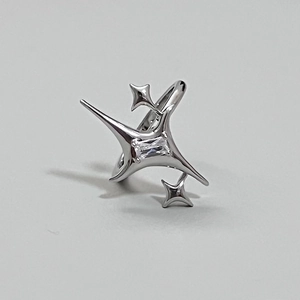 Detailed close-up of a silver star ring featuring a rectangular zircon in a prong setting