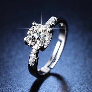 Macro view of a six-prong adjustable silver ring with a sparkling one-carat diamond