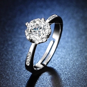 Macro shot of a brilliant-cut moissanite solitaire ring with an adjustable silver band