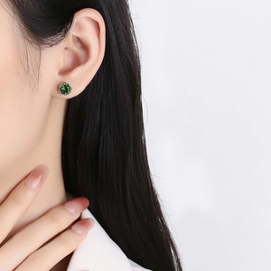 S925 sterling silver emerald zircon stud earrings worn on a model in a high-end style