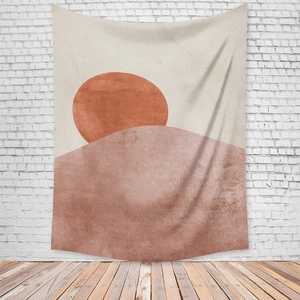 Detailed texture of bohemian sun tapestry hanging on white brick wall with wood floor