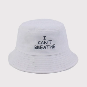 Close-up of 'I CAN'T BREATHE' embroidery on white cotton bucket hat with clean stitching