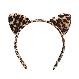 Detail view of leopard print cat ear headband with soft velvet texture on white background