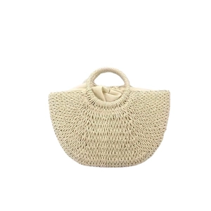 Handwoven semicircular straw tote bag with round handle and drawstring lining for beach