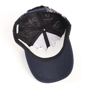 Detail of the 100% cotton baseball cap showing interior floral lining and wash label