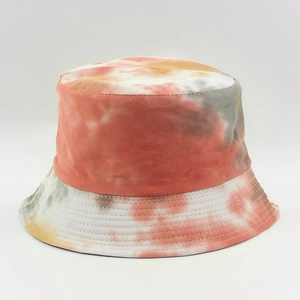 Detailed close-up of stitching on a colorful tie-dye bucket hat made of cotton canvas