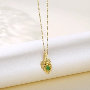 Elegant gold leaf necklace with an oval green gem and micro-pave cubic zirconia accents