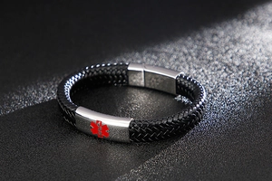Detail of black braided leather medical alert bracelet with stainless steel magnetic clasp