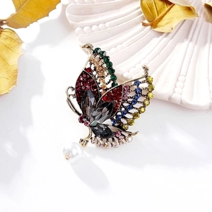 Vintage bronze butterfly brooch with colorful rhinestones and pearl on shell base