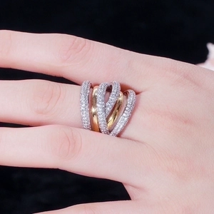 Fashionable multi-layered intertwined ring with sparkling cubic zirconia in gold and silver