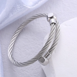 Silver stainless steel cable twisted bangle with unique hexagonal nut end caps