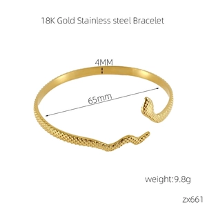 Detailed macro view of 18K gold stainless steel snake bracelet showing scale texture