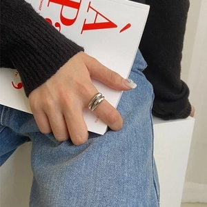 Minimalist silver interlocking thick open ring with a sleek architectural design for women