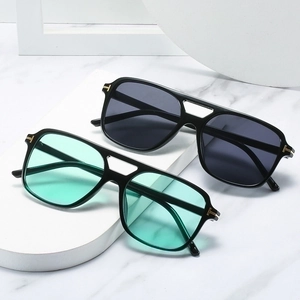 Retro round sunglasses with metal T-shaped accents on marble pedestals, chic design