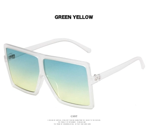 Detail of oversized square sunglasses with blue to yellow gradient lenses and clear frames