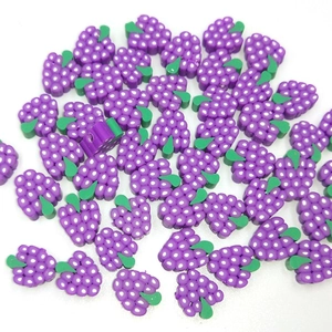 Macro shot of 10mm purple polymer clay grape beads for DIY jewelry and crafts making
