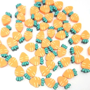 Macro view of 10mm orange polymer clay carrot beads for DIY jewelry making and crafts