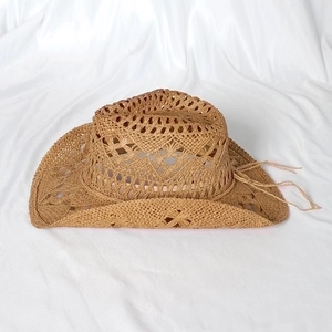Handwoven straw cowboy hat with hollow patterns and adjustable decorative chin strap