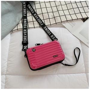 Rose pink mini hardshell suitcase crossbody bag with adjustable FOREVER YOUNG strap