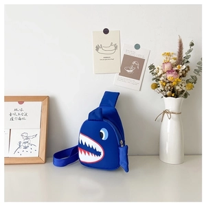 Detailed view of the shark-themed kids sling bag with side fin and zipper closure