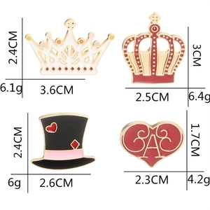 Cartoon enamel lapel pins set with crown, top hat and heart shapes, sizes and weights shown