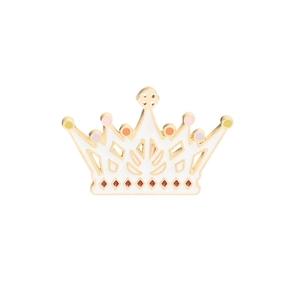 Detail of cute crown enamel pin with colorful dots and golden edges on white background