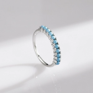 Minimalist S925 sterling silver ring featuring a row of inlaid round turquoise beads