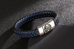 Close-up of woven leather bracelet featuring a steel magnetic clasp with anchor relief