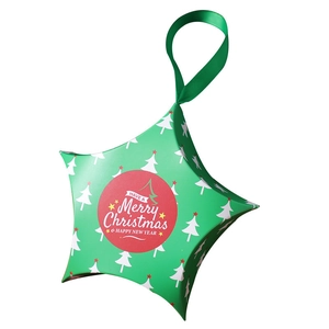 Star-shaped green Christmas gift box with silk ribbon and festive holiday greetings
