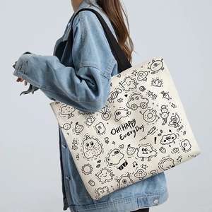 Minimalist canvas tote bag with black cartoon doodles and durable shoulder straps