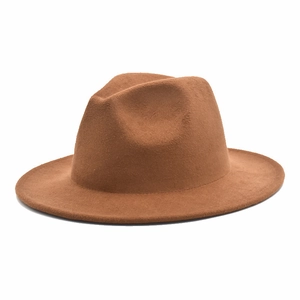 Macro detail of the smooth caramel wool felt texture and structure of the fedora hat