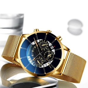 Close-up of Geneva men's gold mesh strap watch with a multi-functional blue dial