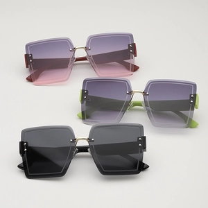 Frameless oversized square sunglasses with metal rivets and multi-color gradient lenses