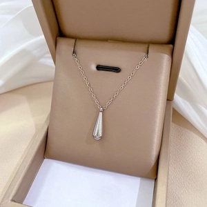 Minimalist titanium steel water drop necklace displayed in a premium jewelry box