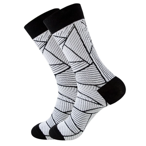 Close-up of black and white geometric leaf pattern on mid-calf knitted cotton socks
