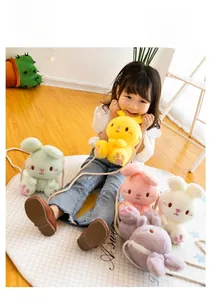 Detail of cute plush bunny crossbody bags in five colors with embroidery and rope straps