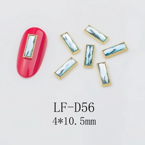 Macro detail of LF-D56 4x10.5mm light blue rectangle nail gemstone with gold bead edging