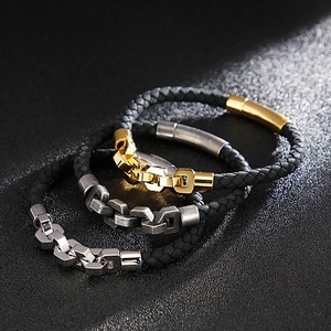 Three men's woven leather bracelets with gold and silver chain link metal accents