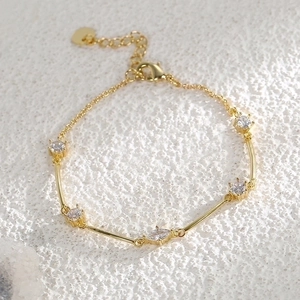 Elegant gold plated brass bracelet with zircon stones and a heart charm for women