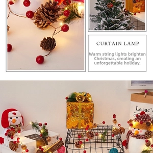 Macro detail of LED string lights with pine cones, red berries and green pine needles