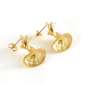 Chic gold bow-shaped earrings with hammered metal texture and modern abstract design