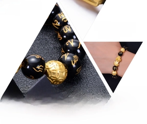 Detailed views of black obsidian bracelet with golden Pixiu and engraved mantra beads