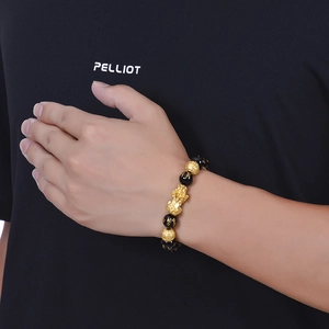 Black obsidian bead bracelet with golden Pixiu charm and carved mantra characters
